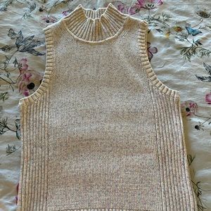 Nude colored 3/4 turtle neck Gap top.  Sleeveless, no smells or stains